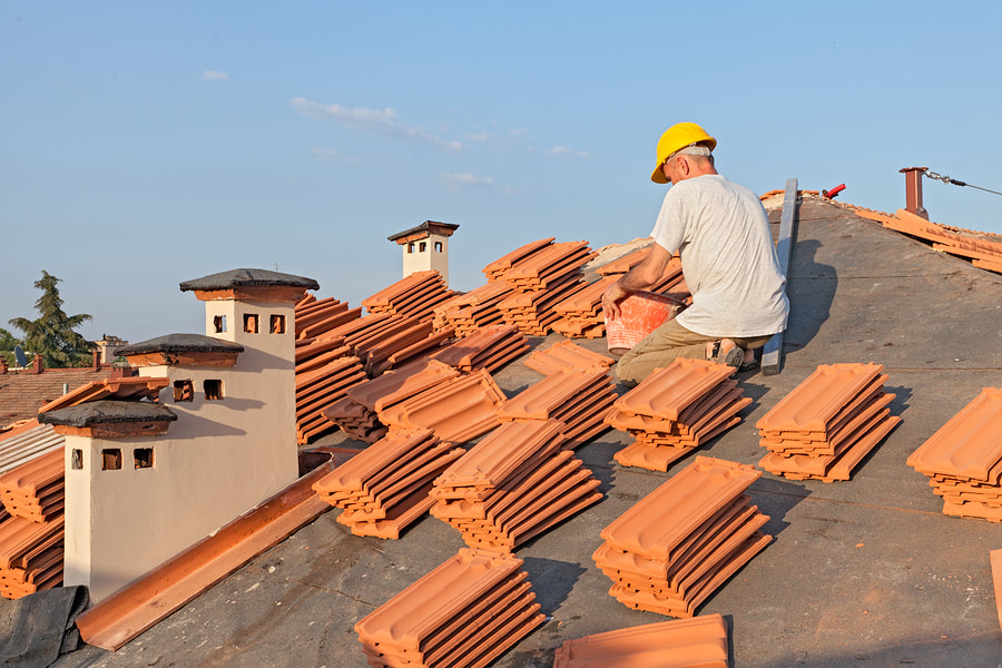 man piling the roof tile